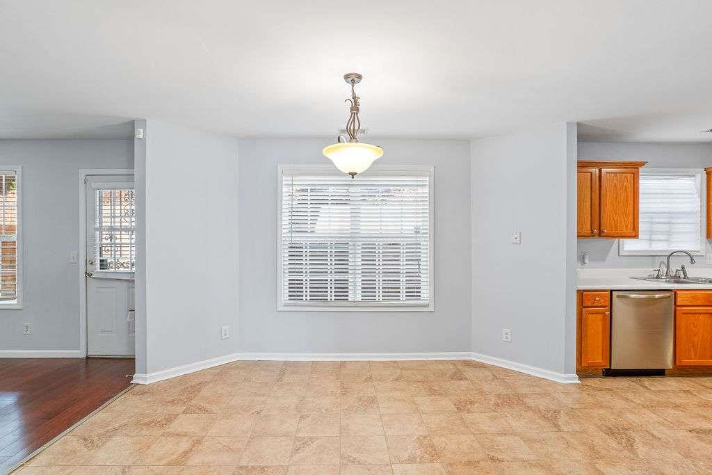 1461 Enchanted Forest Drive Conley, GA 30288 - Photo 10 of 47 a view of an empty room with window and cabinet