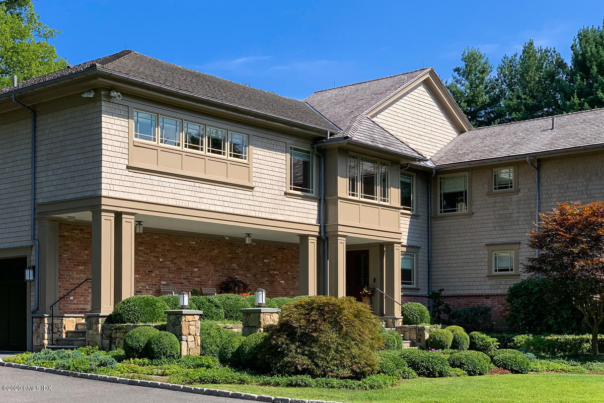 4 Doverton Drive Greenwich, CT 06831 - Photo 2 of 17 a front view of a house with garden