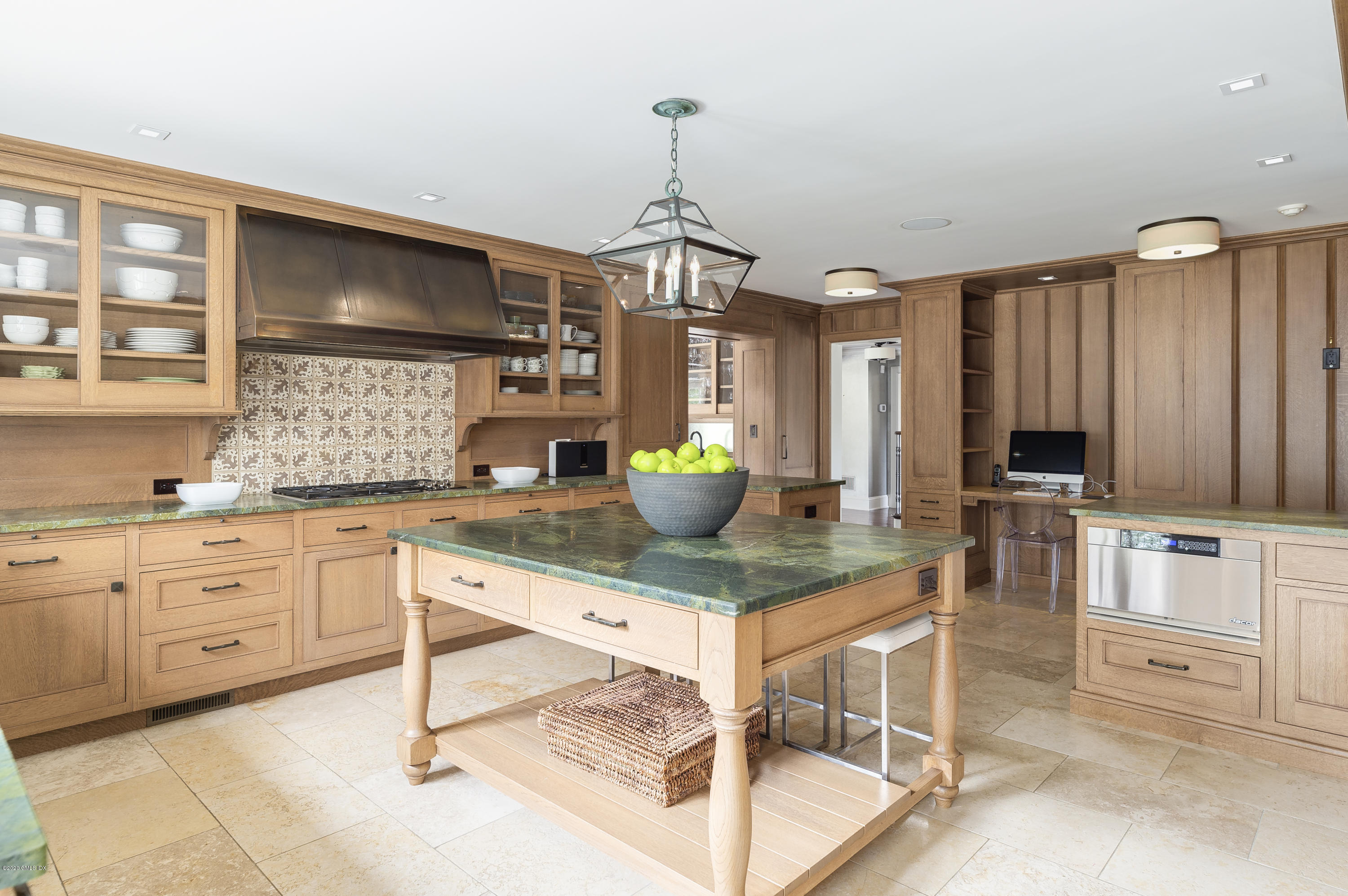 4 Doverton Drive Greenwich, CT 06831 - Photo 6 of 17 a kitchen with white cabinets and appliances