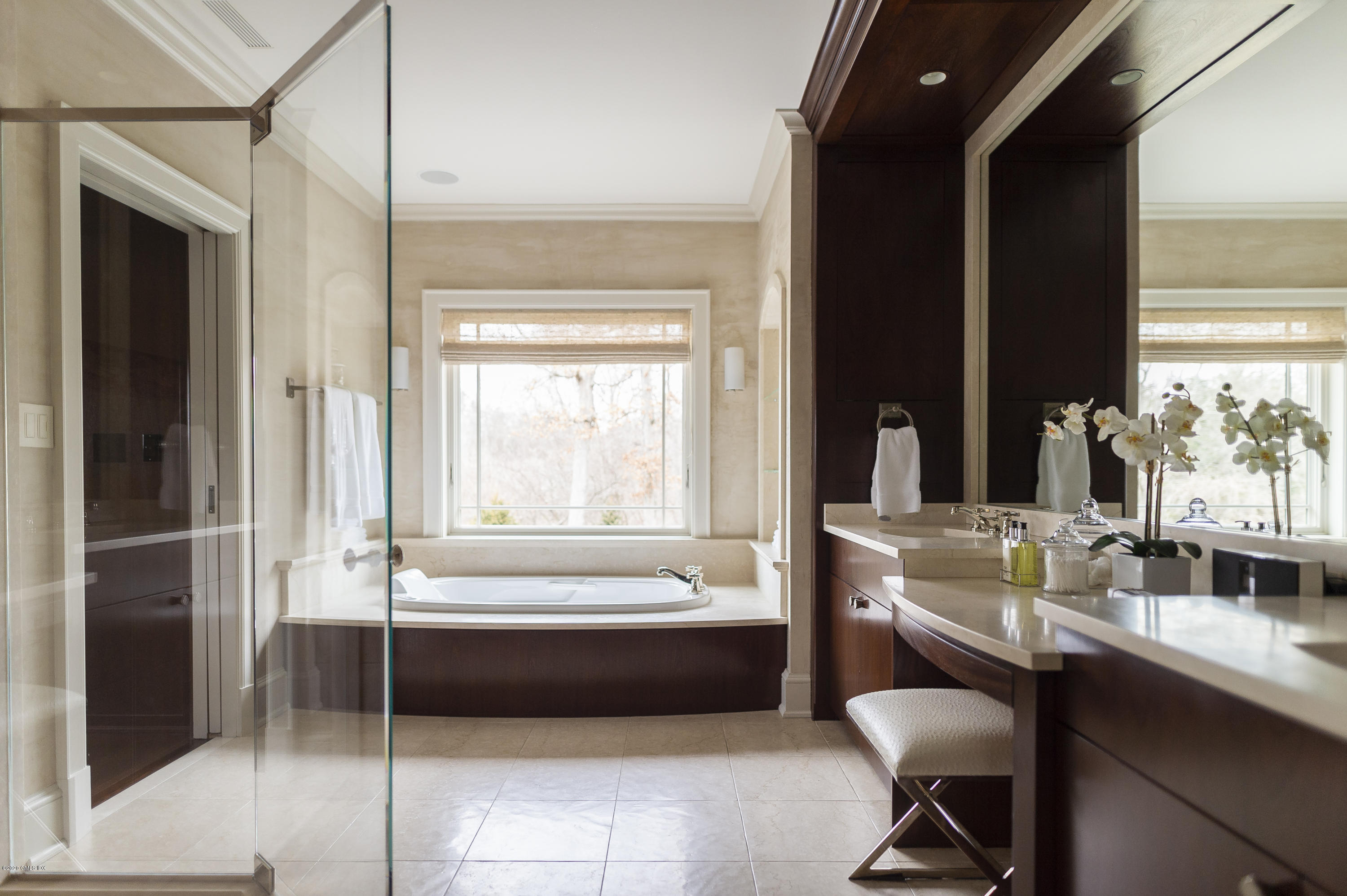 4 Doverton Drive Greenwich, CT 06831 - Photo 9 of 17 a bathroom with a tub a sink and a mirror