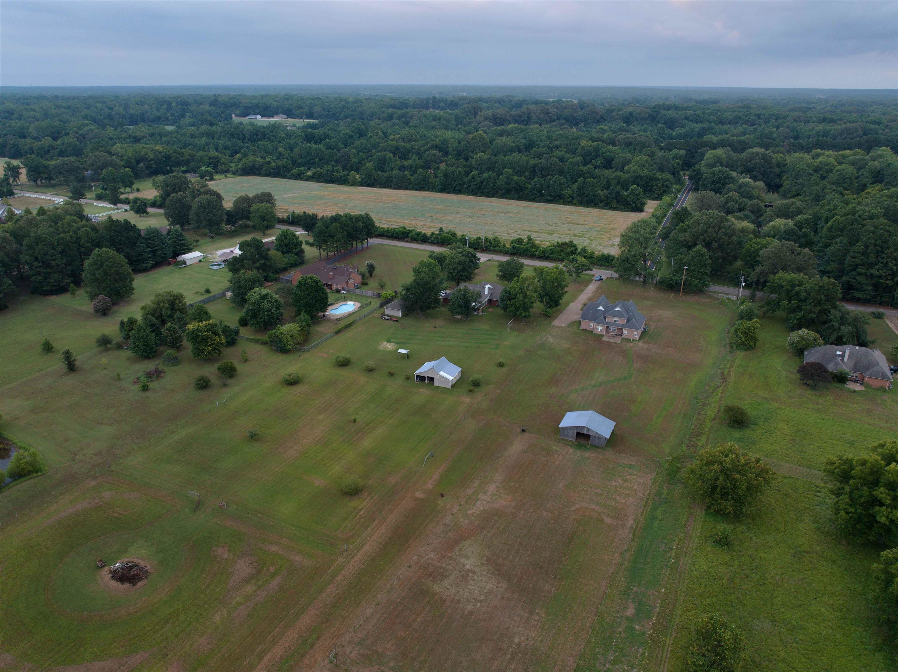 8665 Brunswick Road Millington, TN 38053 - Photo 37 of 39 Aerial view of property and surrounding area featuring rural landscape and a forest
