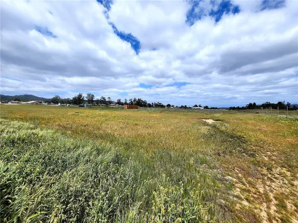 a view of a lake and a houses in the background