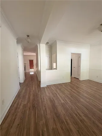 wooden floor in an empty room with a fireplace