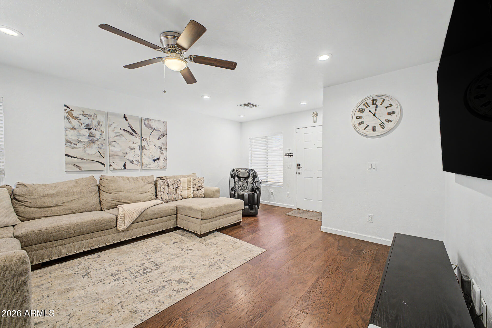 12008 West Larkspur Road El Mirage, AZ 85335 - Photo 2 of 25 a living room with furniture and a table