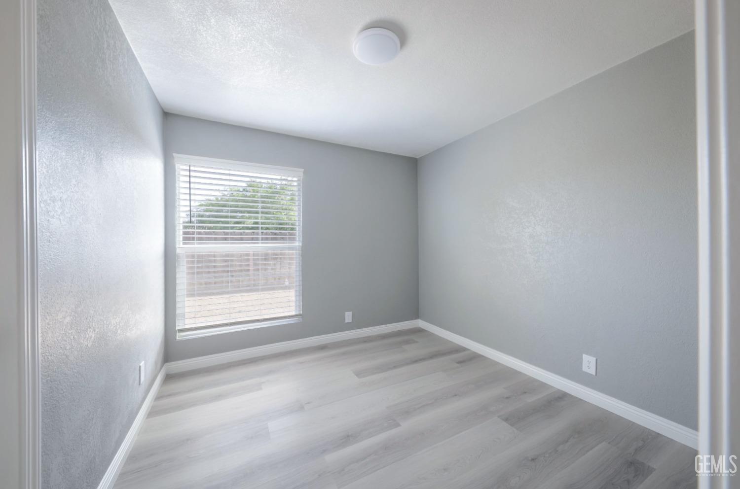Undisclosed Address Bakersfield, CA 93306 - Photo 14 of 44 an empty room with a window