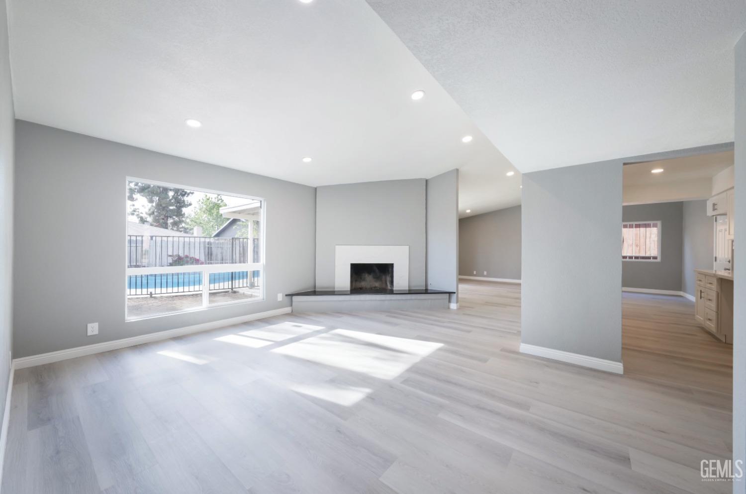 Undisclosed Address Bakersfield, CA 93306 - Photo 24 of 44 a view of an empty room with wooden floor and a window