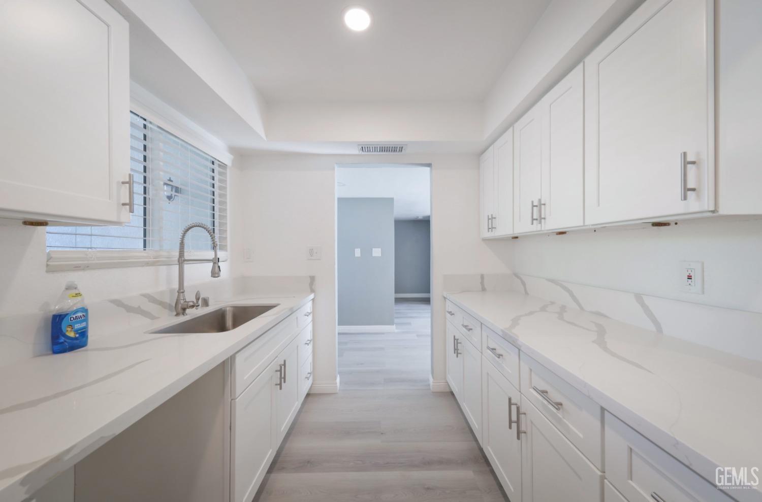 Undisclosed Address Bakersfield, CA 93306 - Photo 28 of 44 a spacious bathroom with cabinets and sink