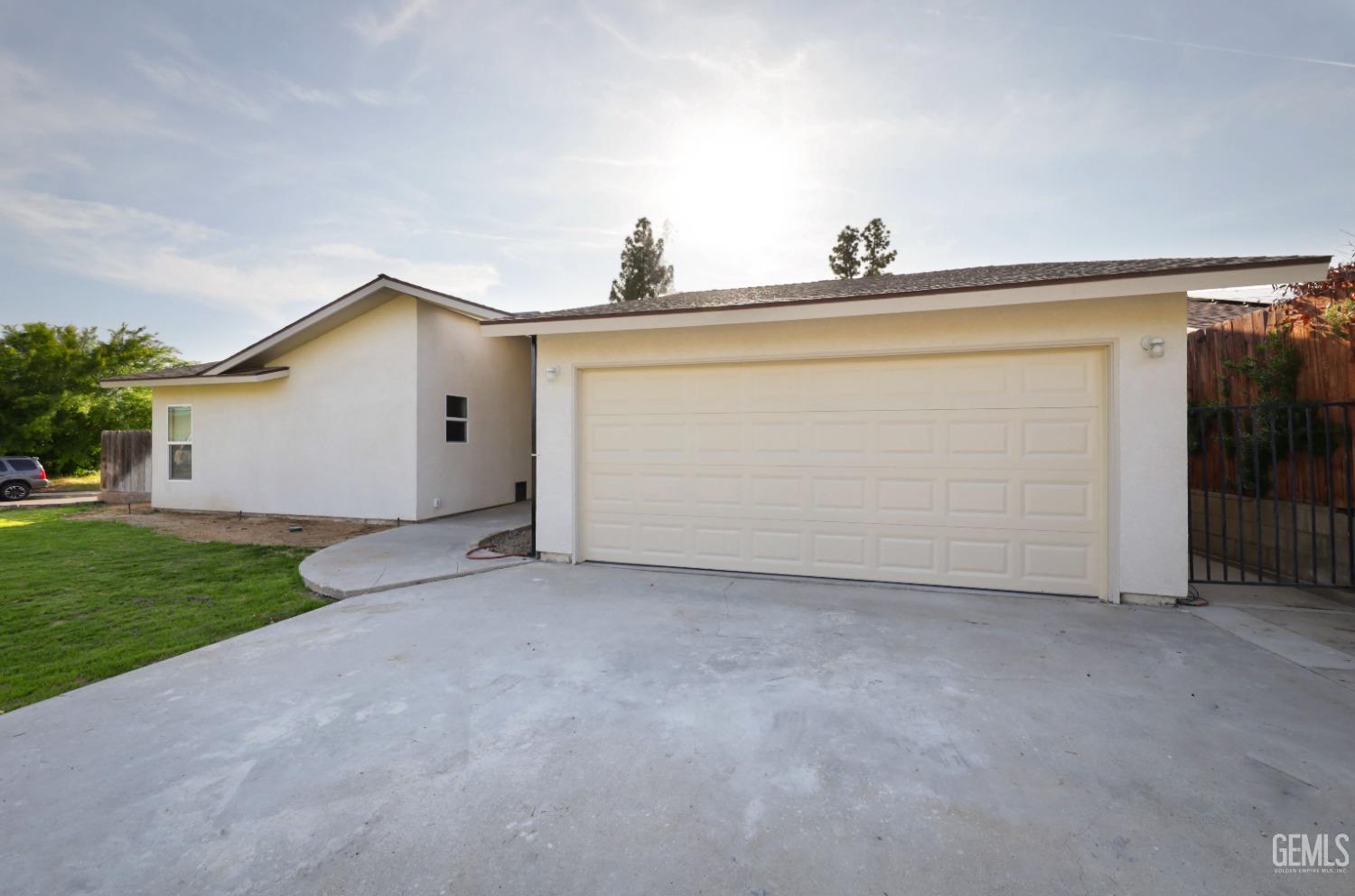 Undisclosed Address Bakersfield, CA 93306 - Photo 3 of 44 a view of a house with garage