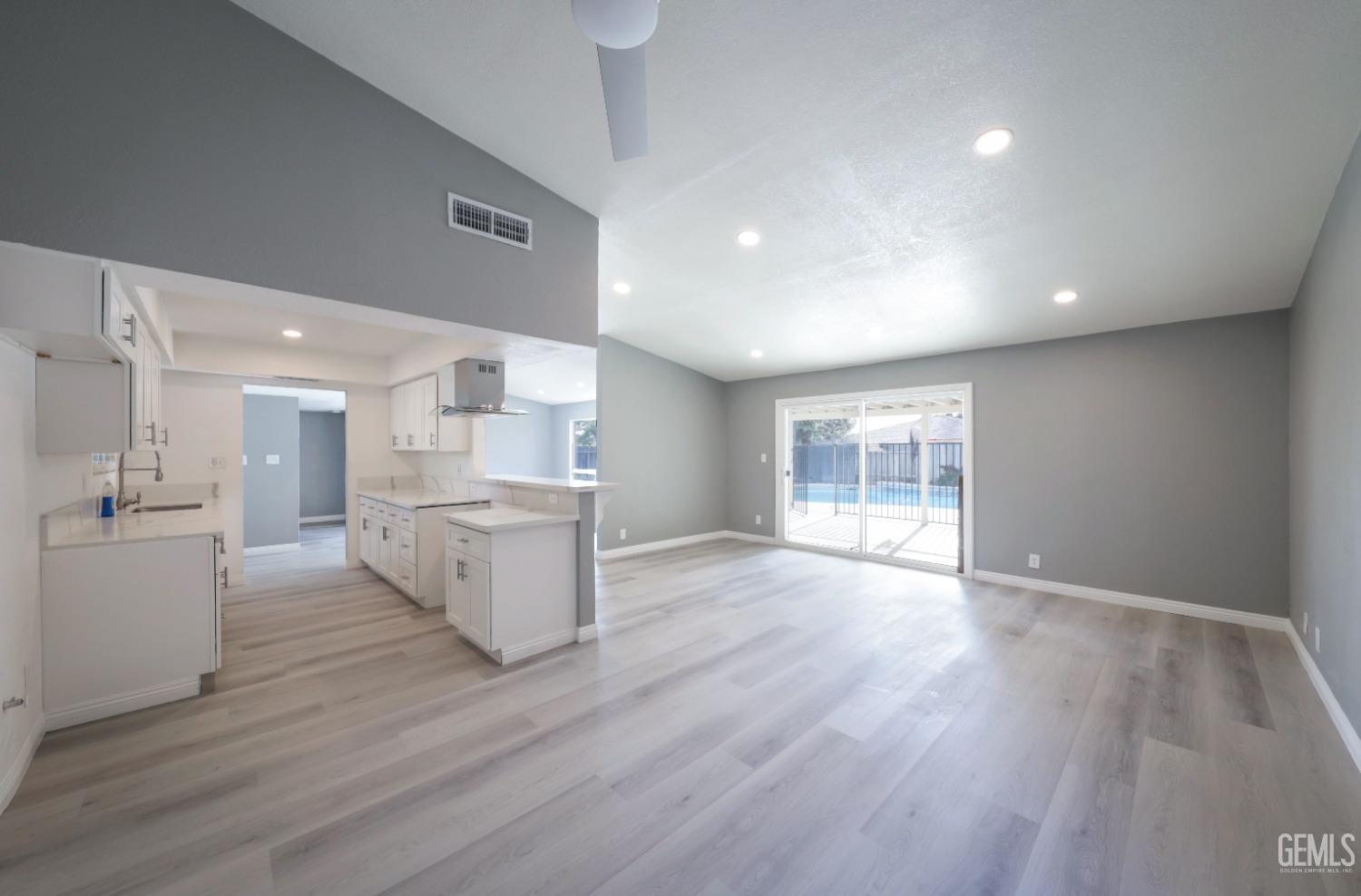 Undisclosed Address Bakersfield, CA 93306 - Photo 32 of 44 a view of a kitchen with wooden floor and windows