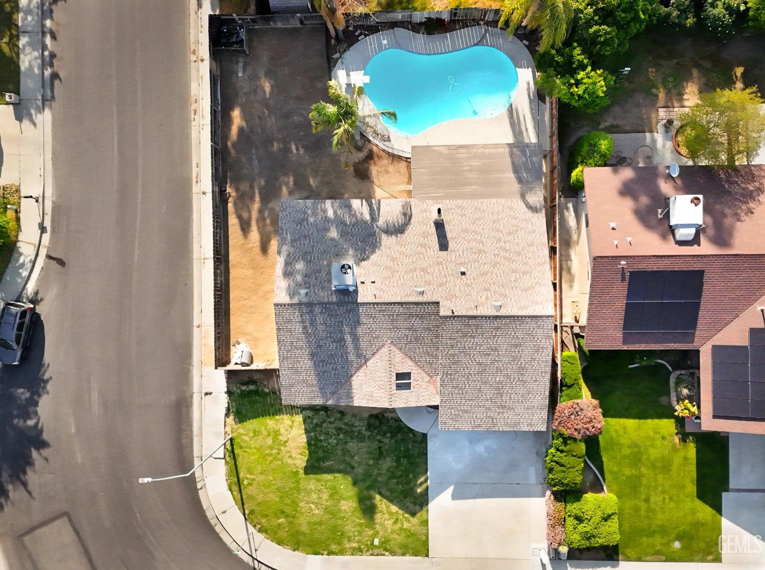 Undisclosed Address Bakersfield, CA 93306 - Photo 7 of 44 an aerial view of a house with a swimming pool