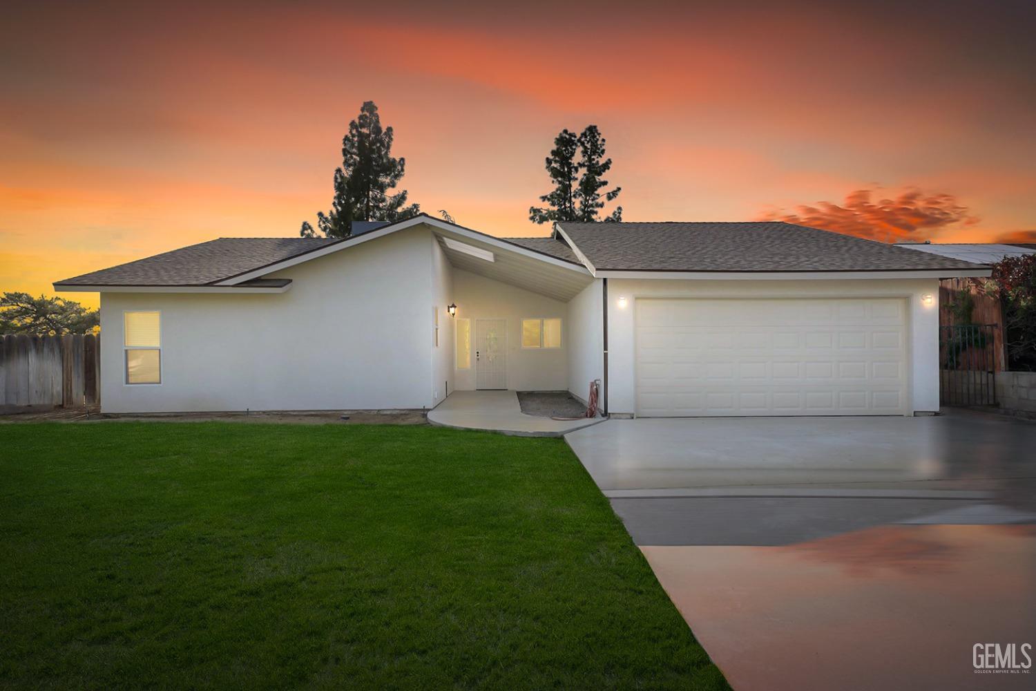Undisclosed Address Bakersfield, CA 93306 - Photo 9 of 44 a front view of a house with a yard