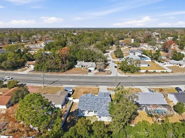 an aerial view of residential houses with outdoor space