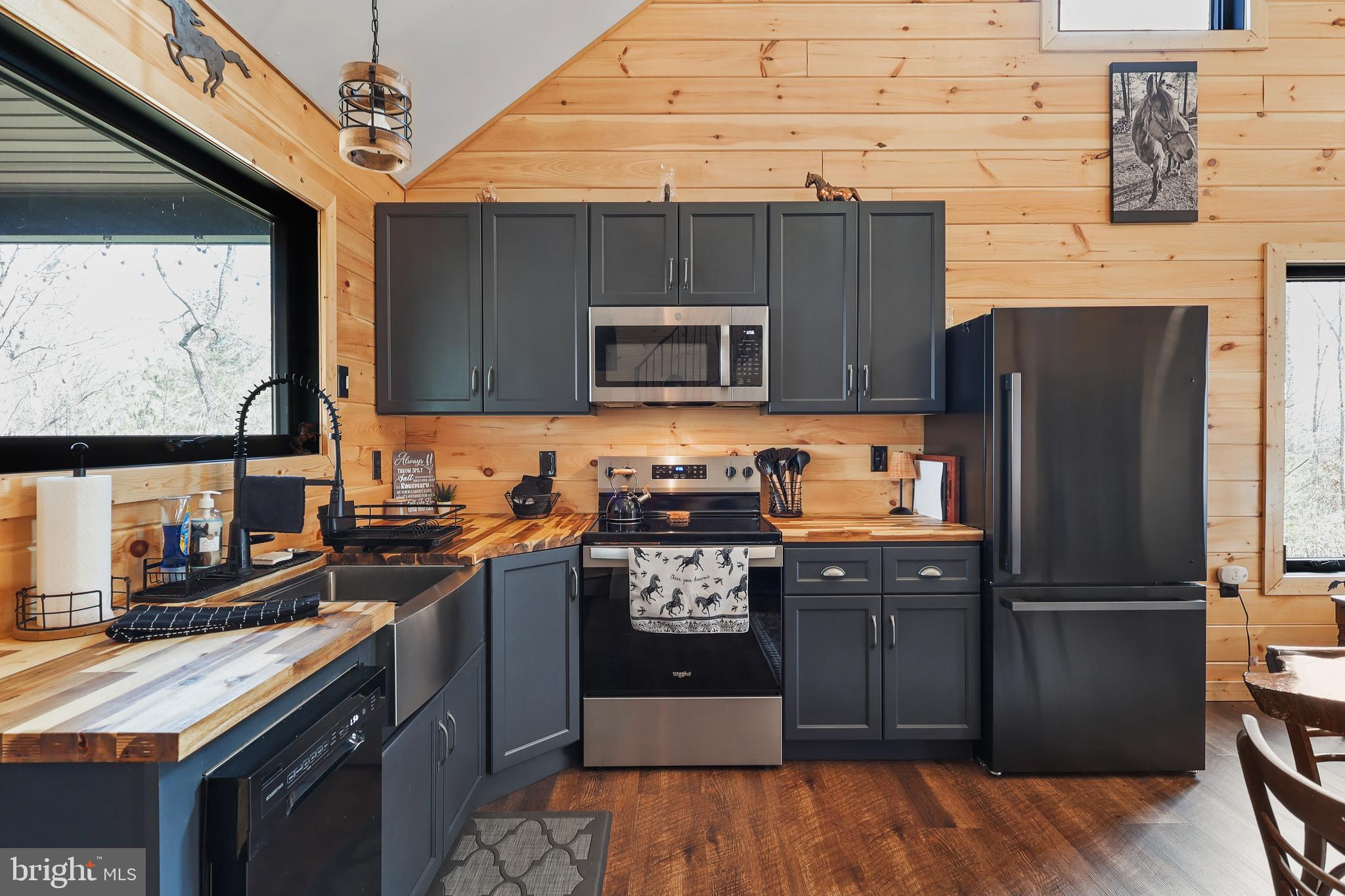 1823 Desert Road Reva, VA 22735 - Photo 13 of 28 a kitchen with granite countertop a refrigerator stove and sink
