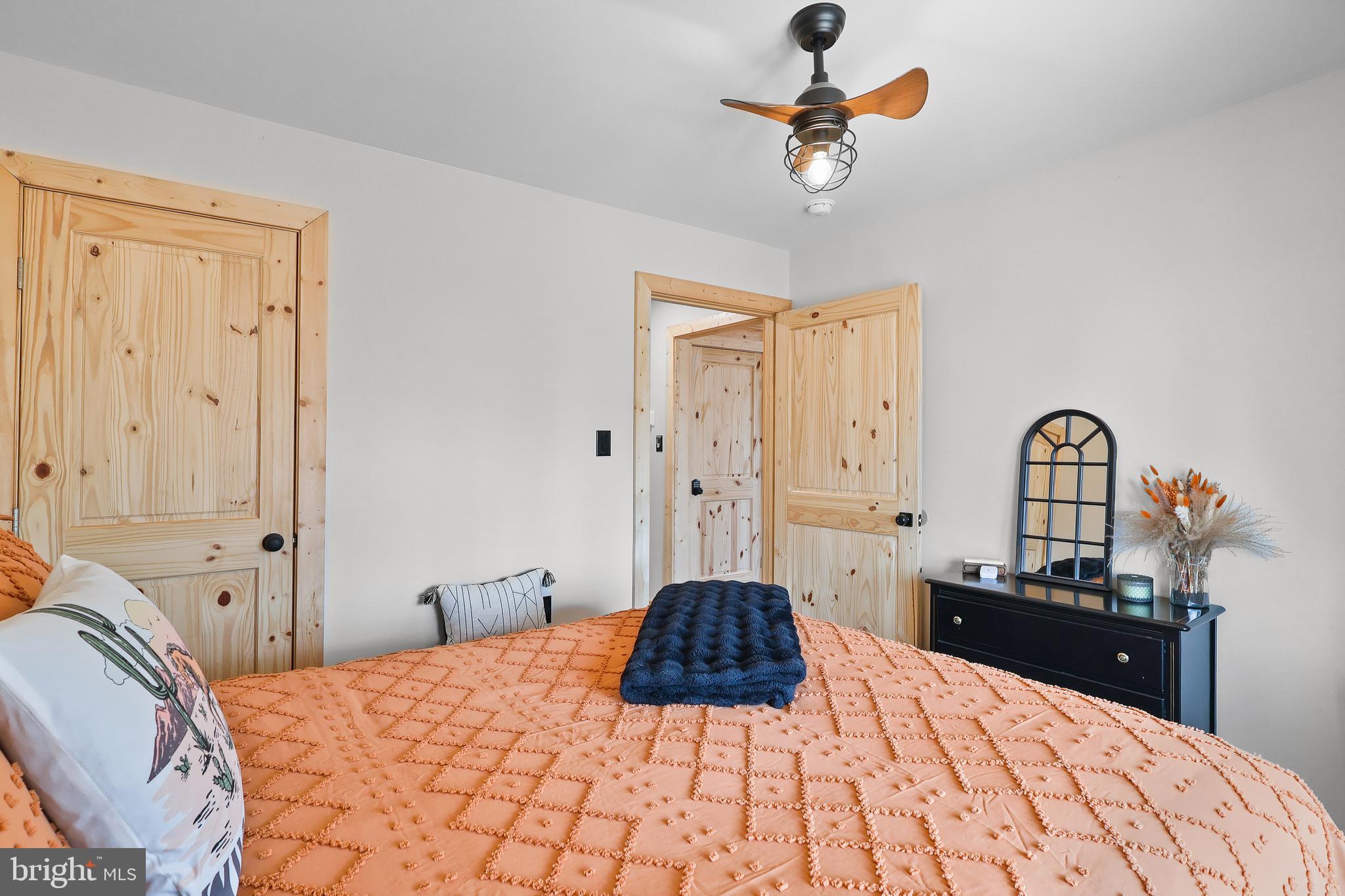 1823 Desert Road Reva, VA 22735 - Photo 16 of 28 a bedroom with a bed and a chandelier