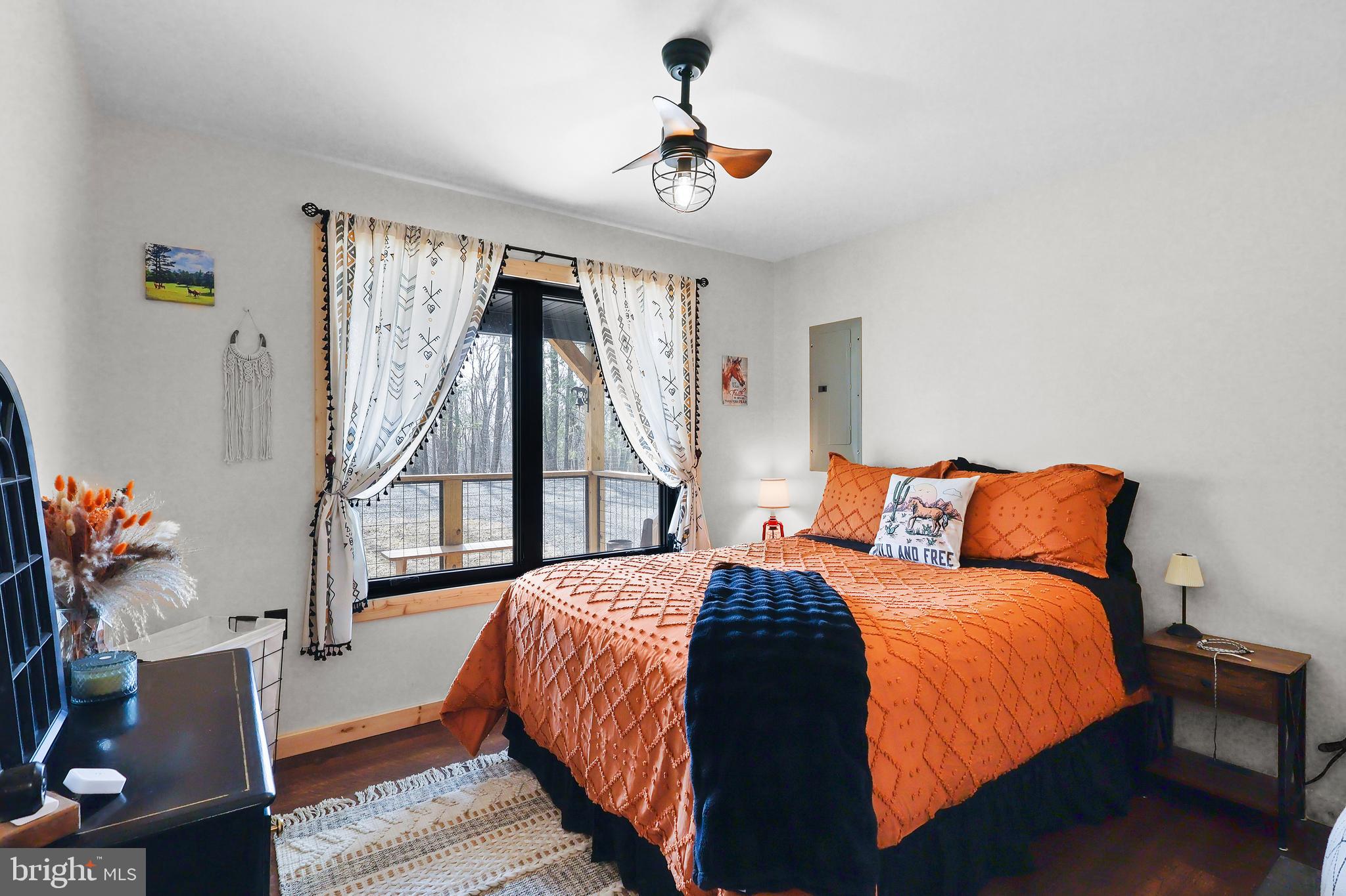 1823 Desert Road Reva, VA 22735 - Photo 17 of 28 a bedroom with a bed and a chandelier