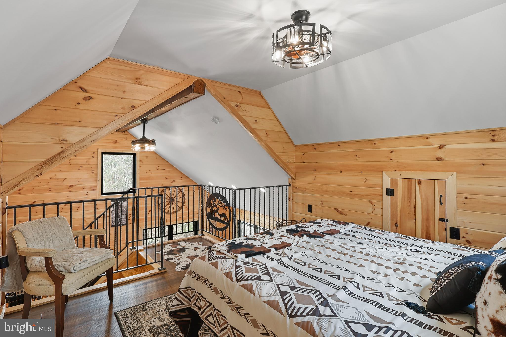 1823 Desert Road Reva, VA 22735 - Photo 22 of 28 a bedroom with a bed and wooden floor