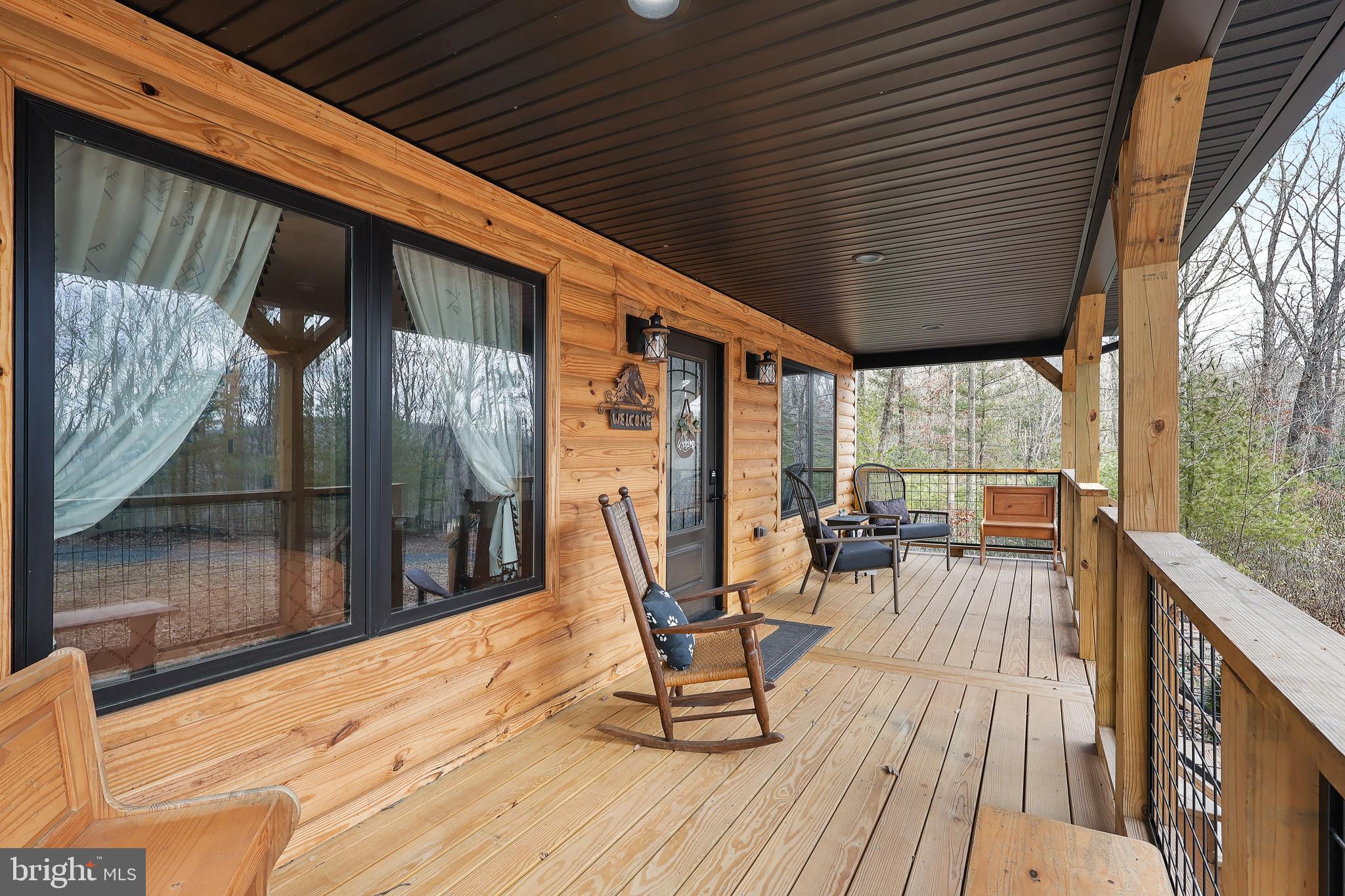 1823 Desert Road Reva, VA 22735 - Photo 6 of 28 a sitting area with furniture on wooden deck