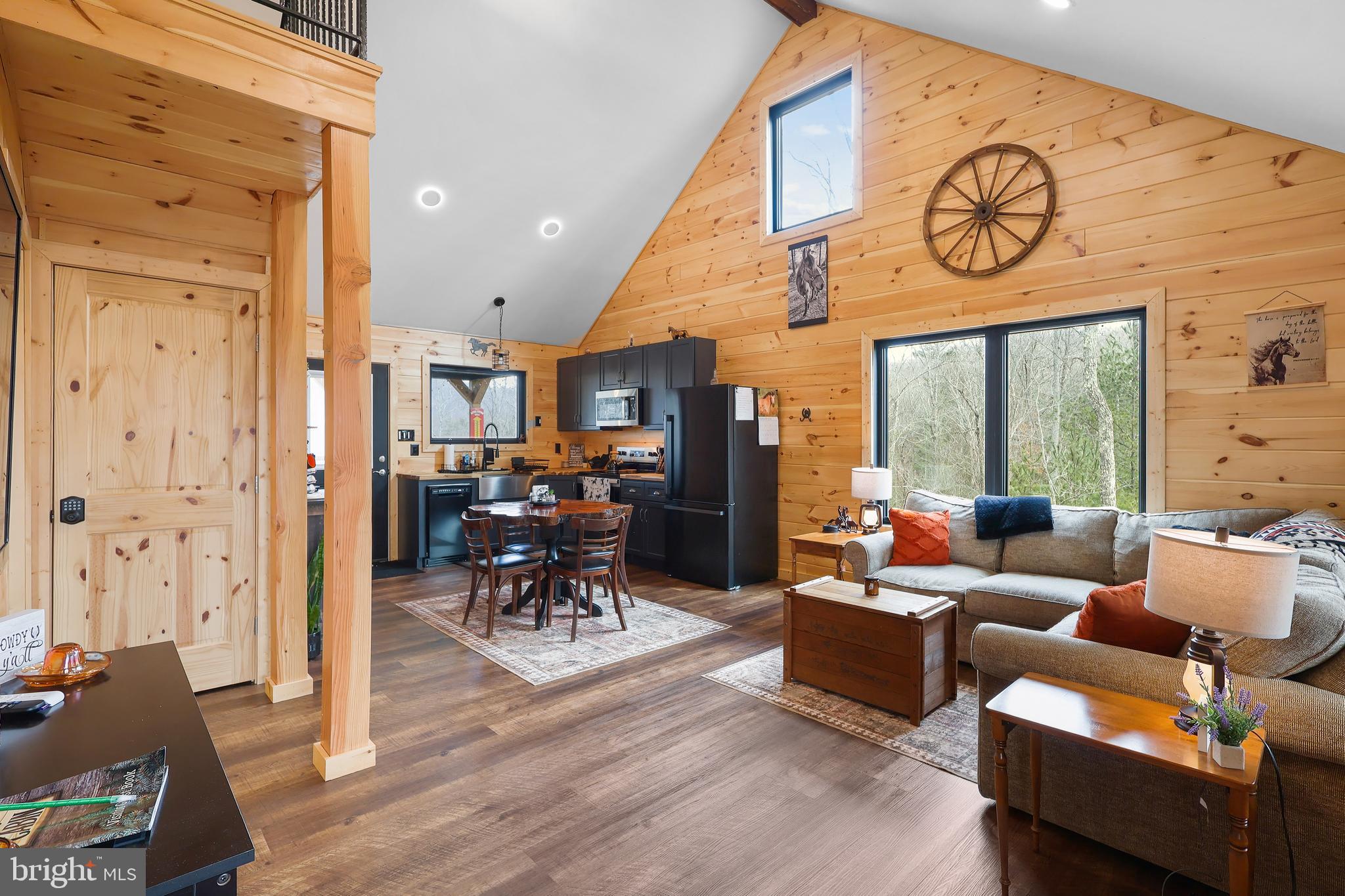 1823 Desert Road Reva, VA 22735 - Photo 8 of 28 a living room with furniture a dining table and chairs next to a window