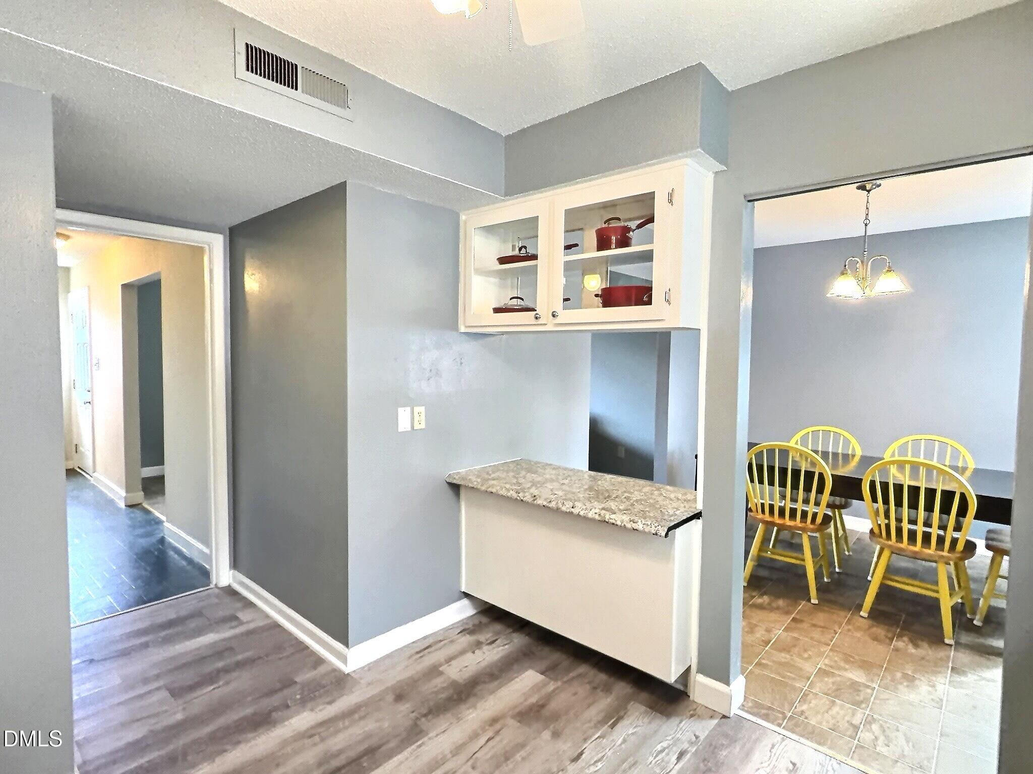 2375 Champion Court Raleigh, NC 27606 - Photo 13 of 31 a kitchen with furniture and a table
