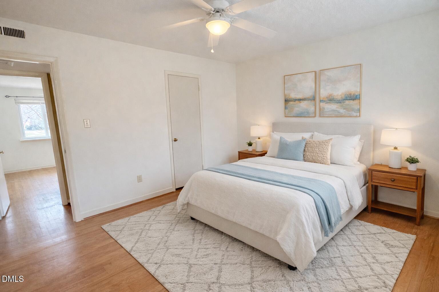 2375 Champion Court Raleigh, NC 27606 - Photo 24 of 31 a bedroom with a bed and wooden floor