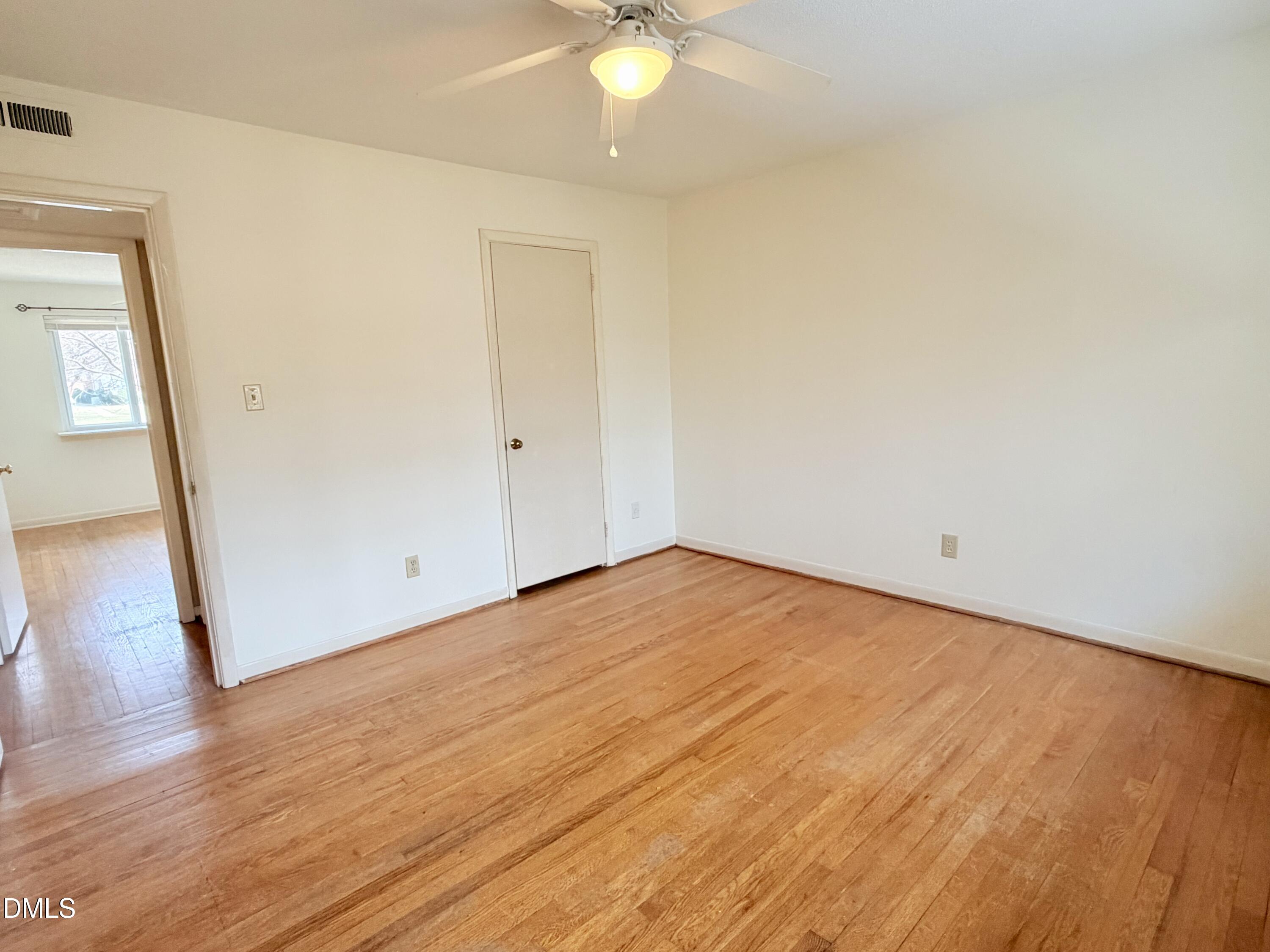 2375 Champion Court Raleigh, NC 27606 - Photo 25 of 31 a view of an empty room and wooden floor