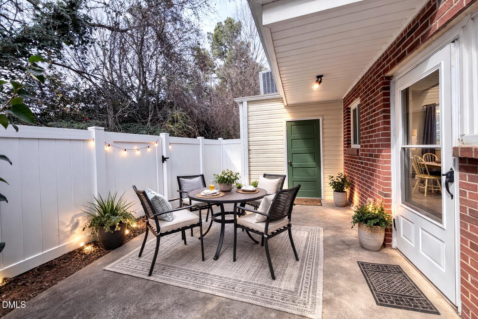 2375 Champion Court Raleigh, NC 27606 - Photo 28 of 31 a view of a patio with table and chairs and potted plants