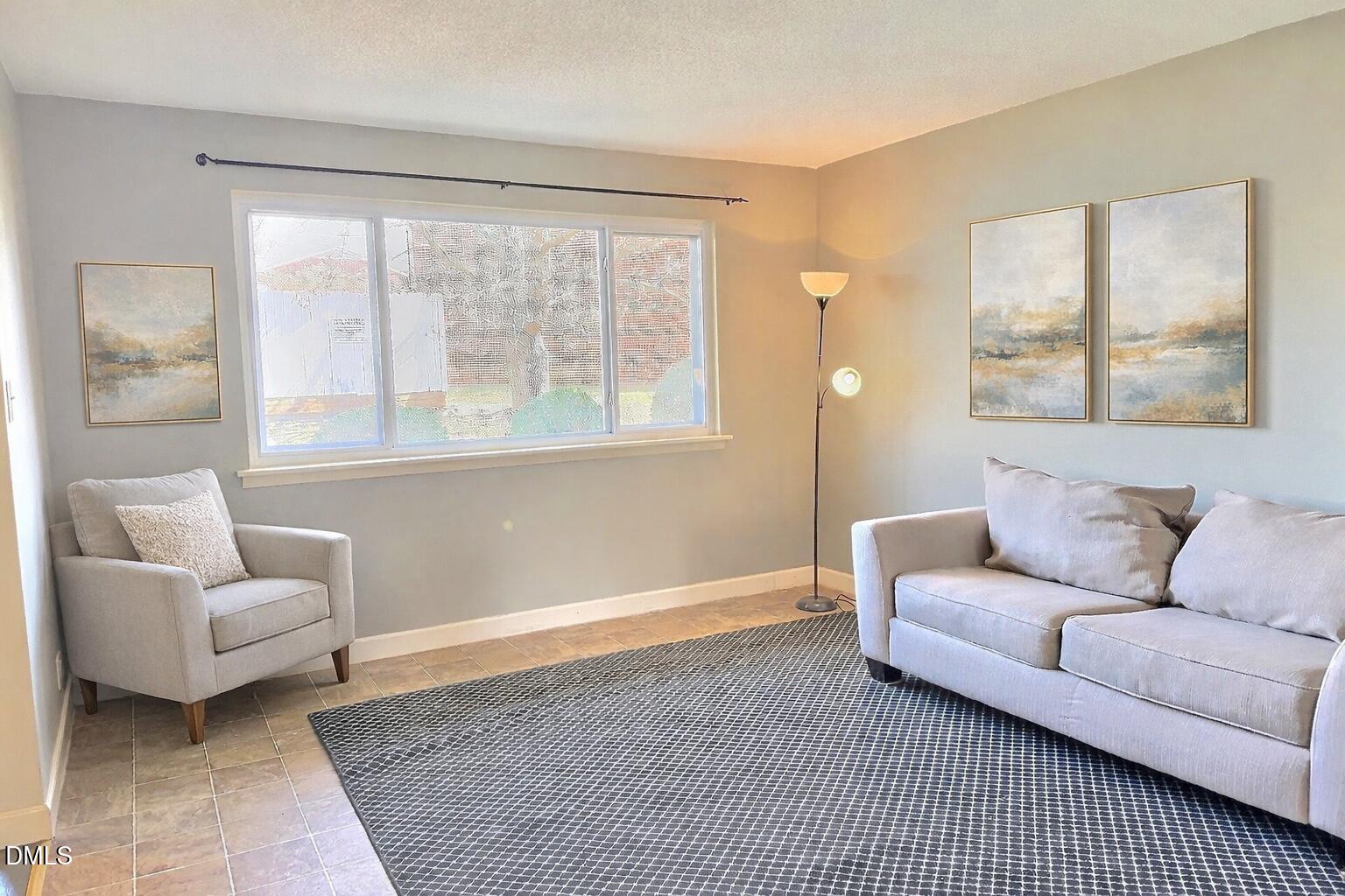 2375 Champion Court Raleigh, NC 27606 - Photo 4 of 31 a living room with furniture and a window