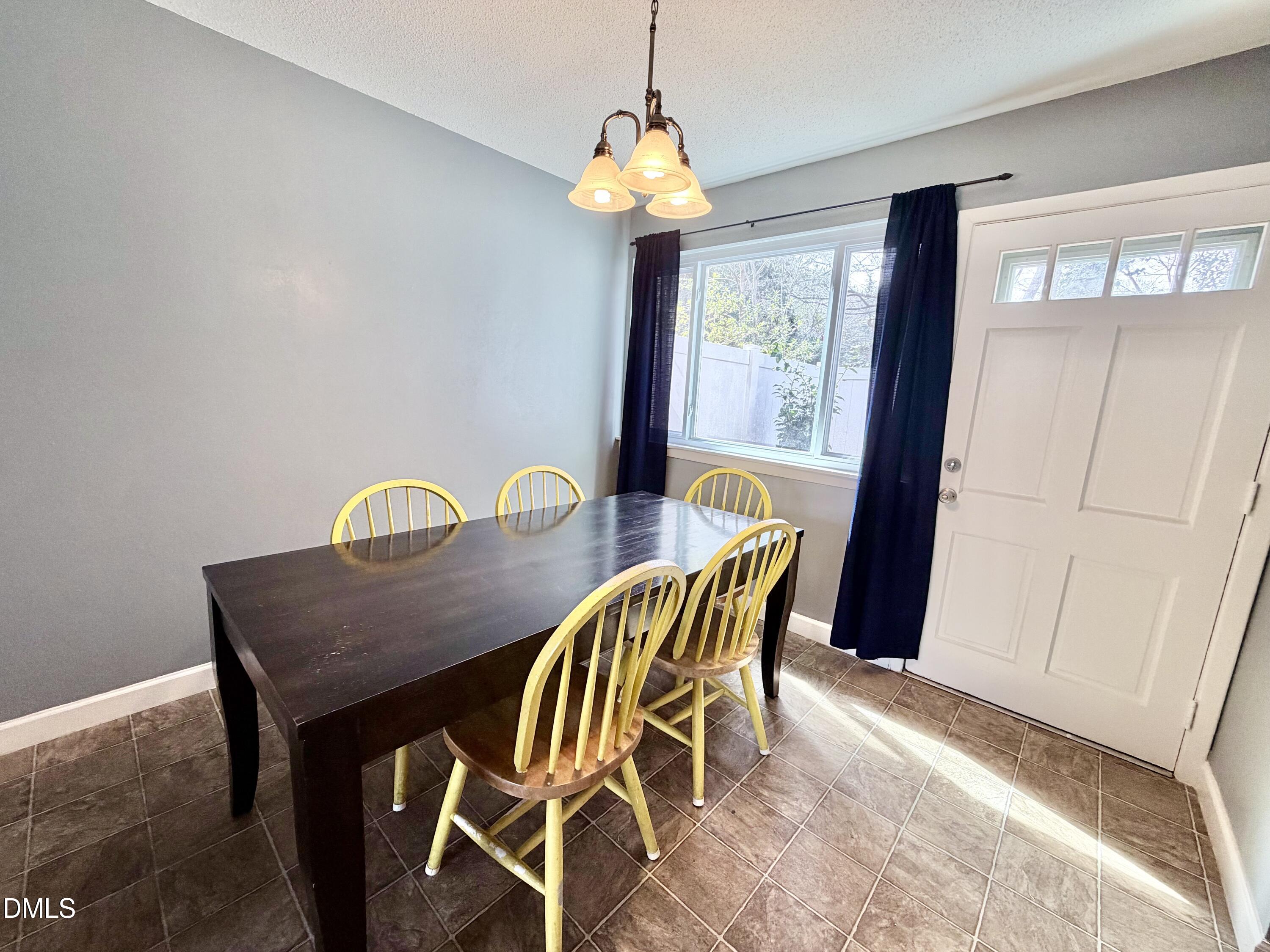 2375 Champion Court Raleigh, NC 27606 - Photo 10 of 31 a dining room with furniture and window