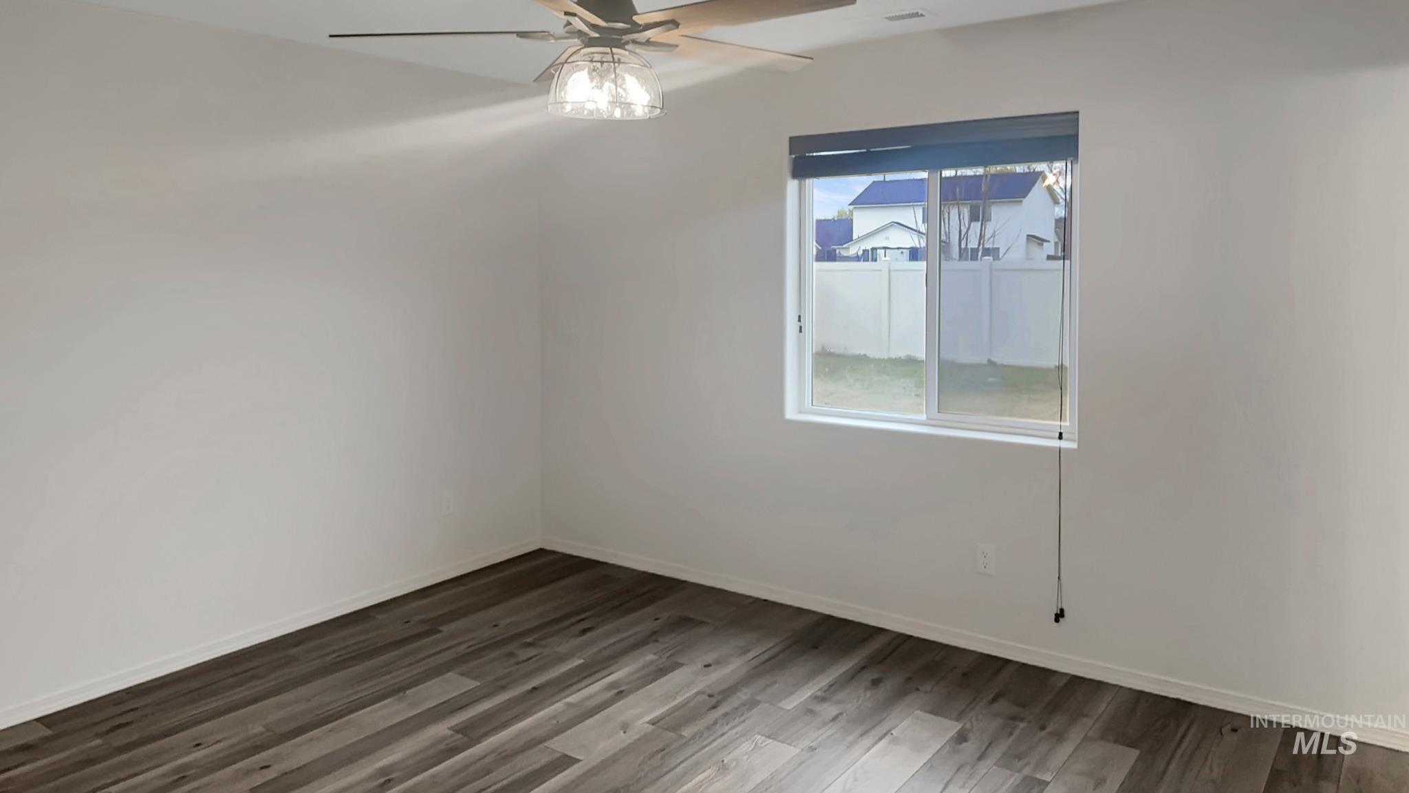 5223 Junegrass Way Caldwell, ID 83607 - Photo 11 of 16 Spare room with wood finished floors and a ceiling fan
