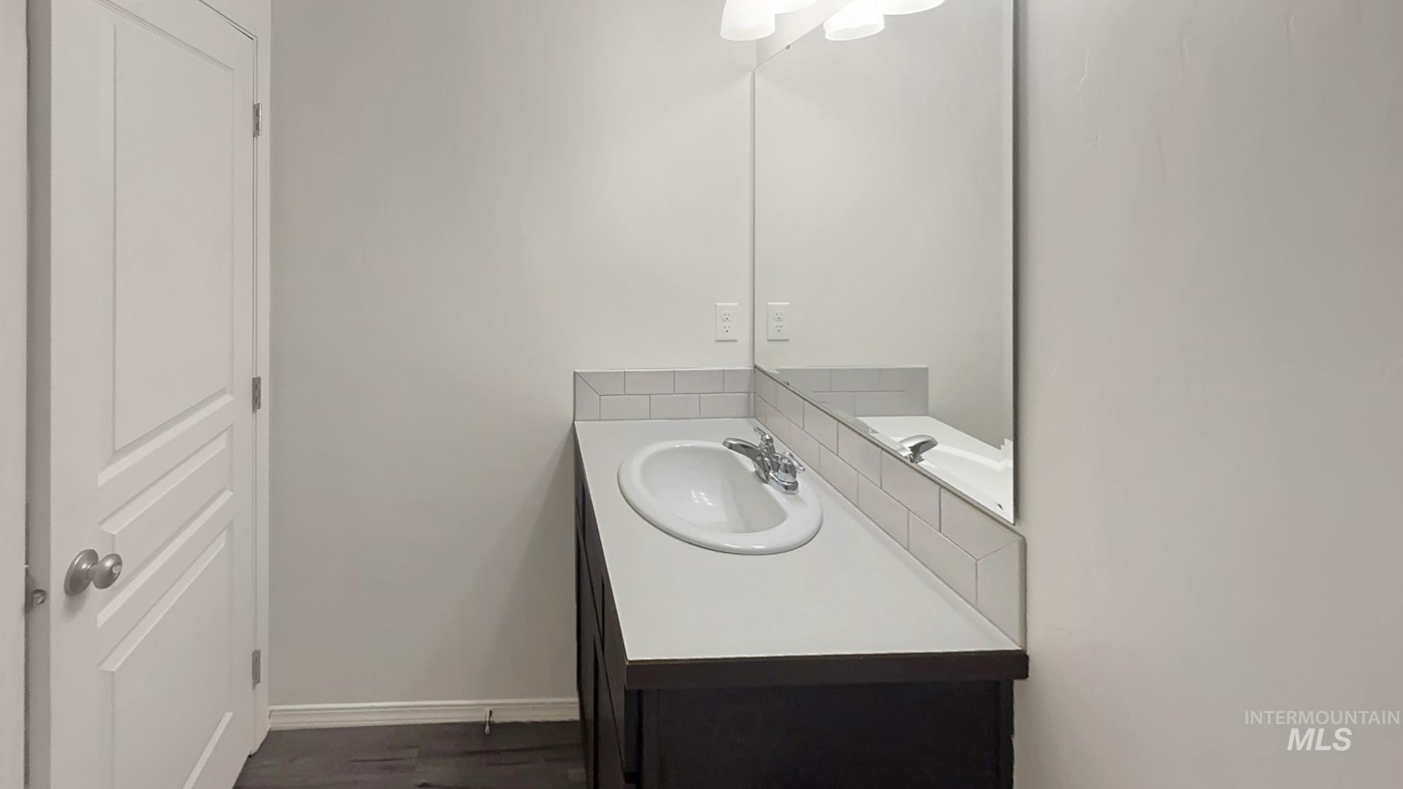 5223 Junegrass Way Caldwell, ID 83607 - Photo 8 of 16 Bathroom with vanity and baseboards