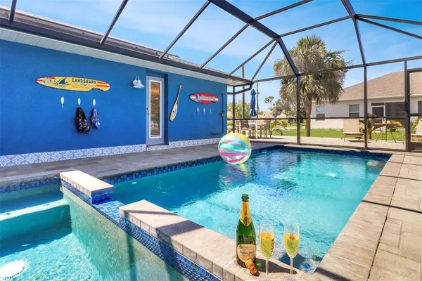 a view of swimming pool with a patio