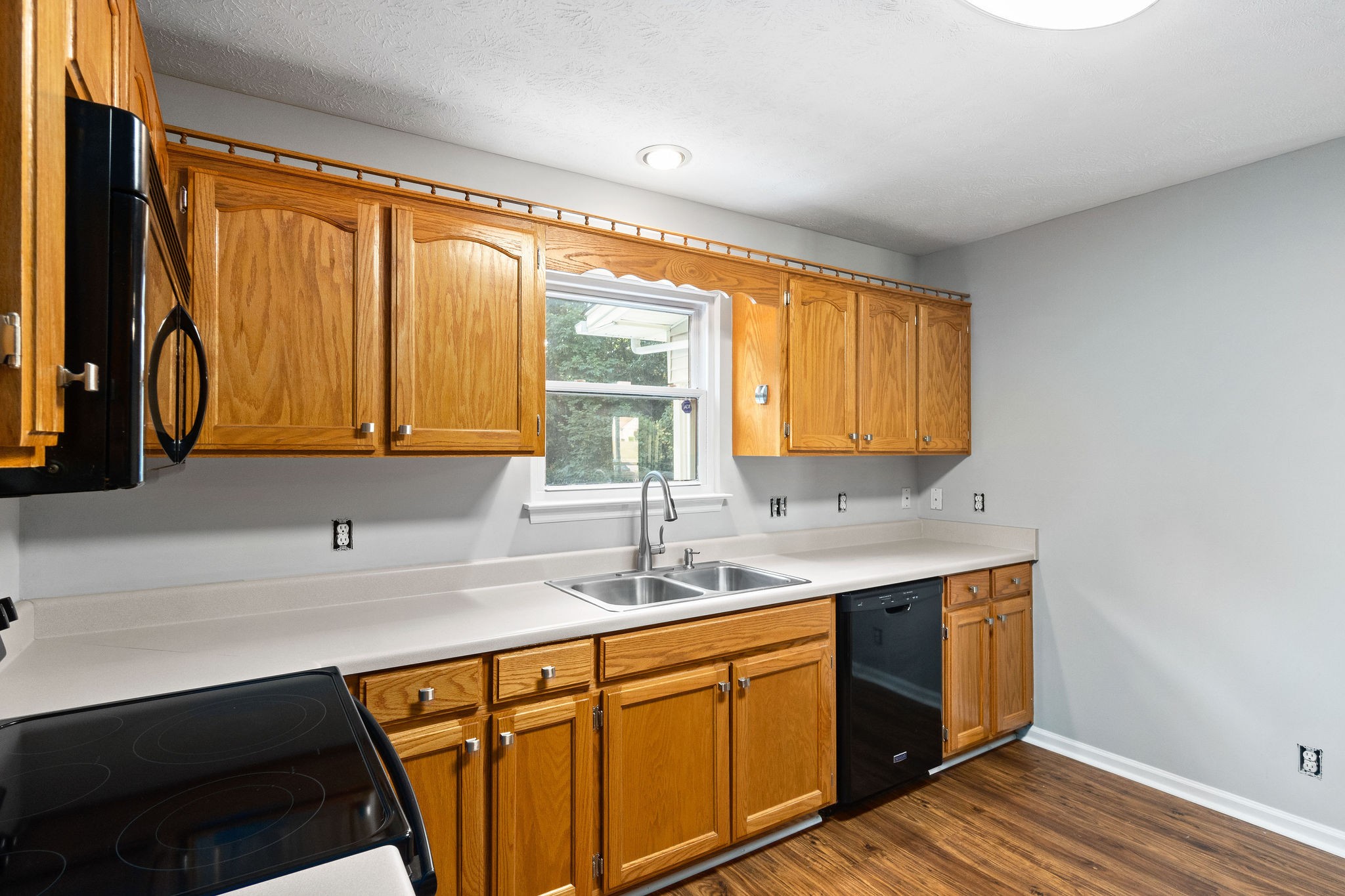 1011 Cherokee Trail Springfield, TN 37172 - Photo 16 of 40 a kitchen with stainless steel appliances granite countertop a sink and a window