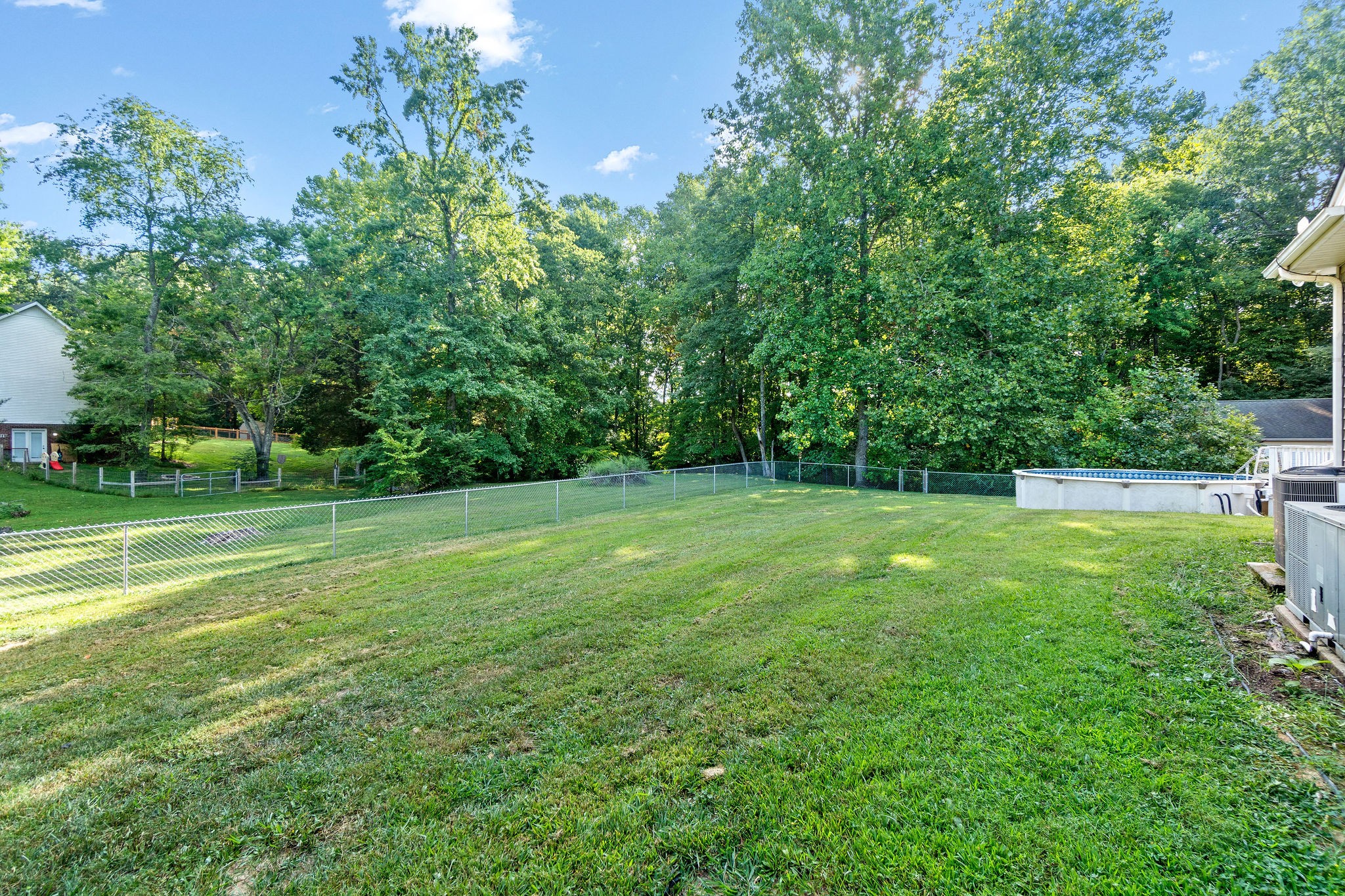1011 Cherokee Trail Springfield, TN 37172 - Photo 37 of 40 a view of a green field with wooden fence