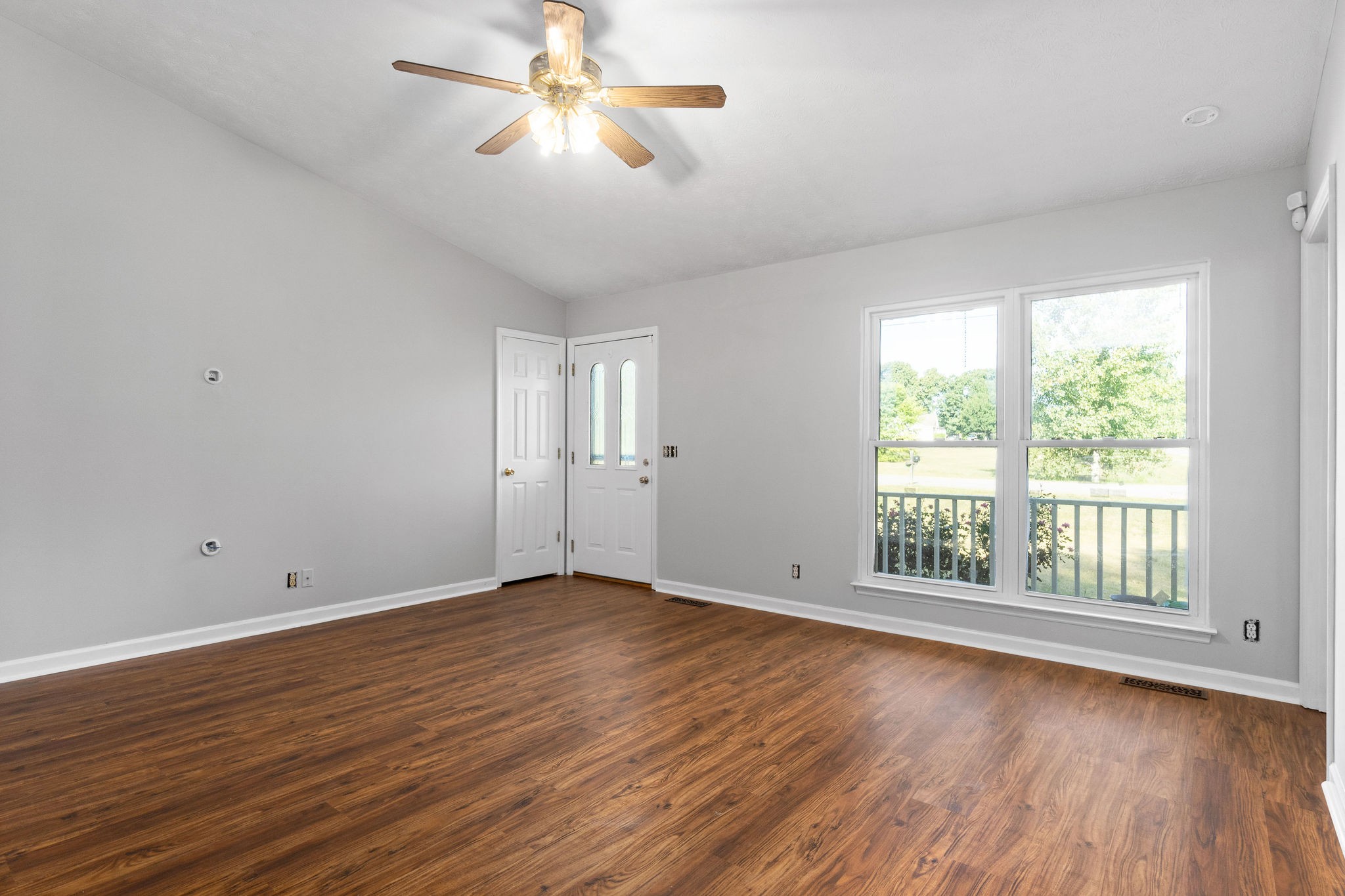1011 Cherokee Trail Springfield, TN 37172 - Photo 10 of 40 a view of empty room with wooden floor and fan