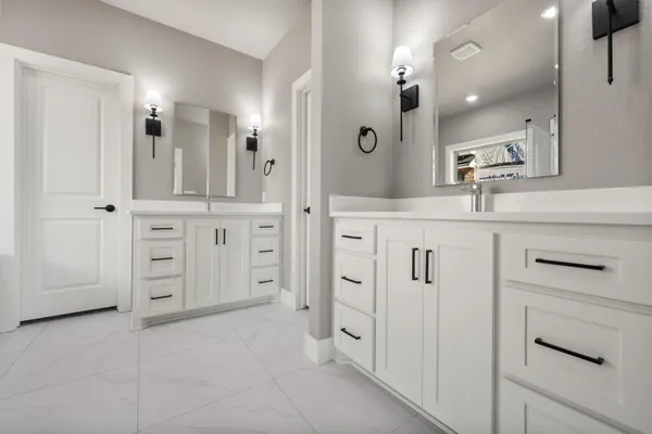 a spacious bathroom with a shower and a sink