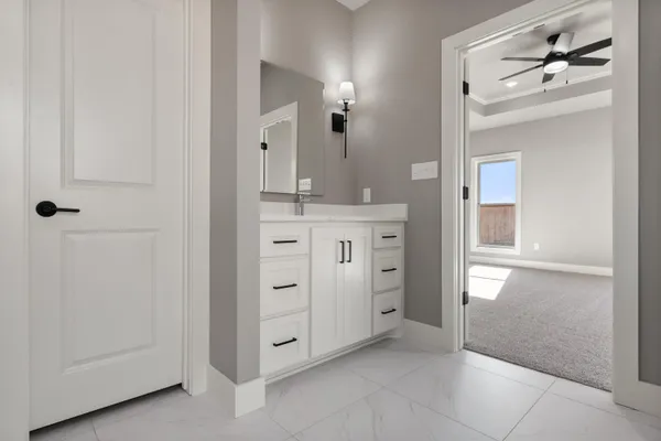 a spacious bathroom with a shower and a sink