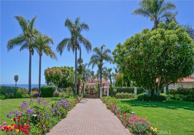a view of a garden with an ocean