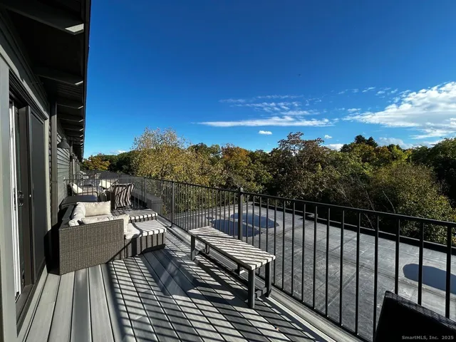 a view of balcony with furniture