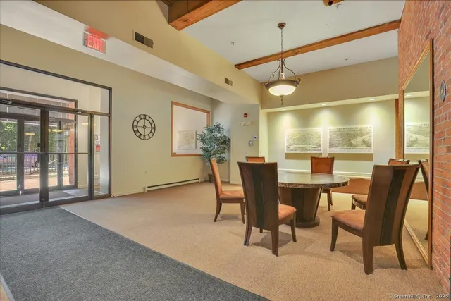a view of a dining room with furniture and window