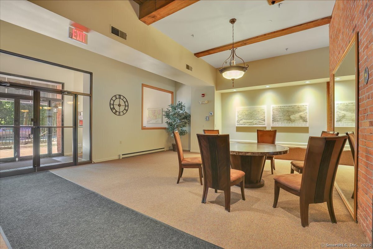 234 South Main Street, Unit 410 Middletown, CT 06457 - Photo 20 of 20 a view of a dining room with furniture and window