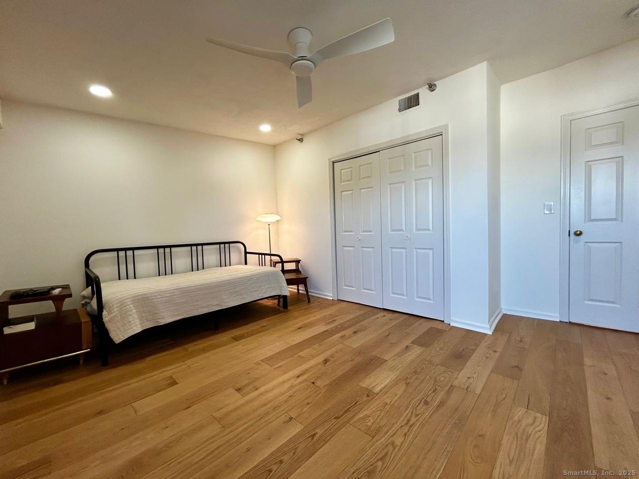 234 South Main Street, Unit 410 Middletown, CT 06457 - Photo 10 of 20 a view of a big room with wooden floor and windows