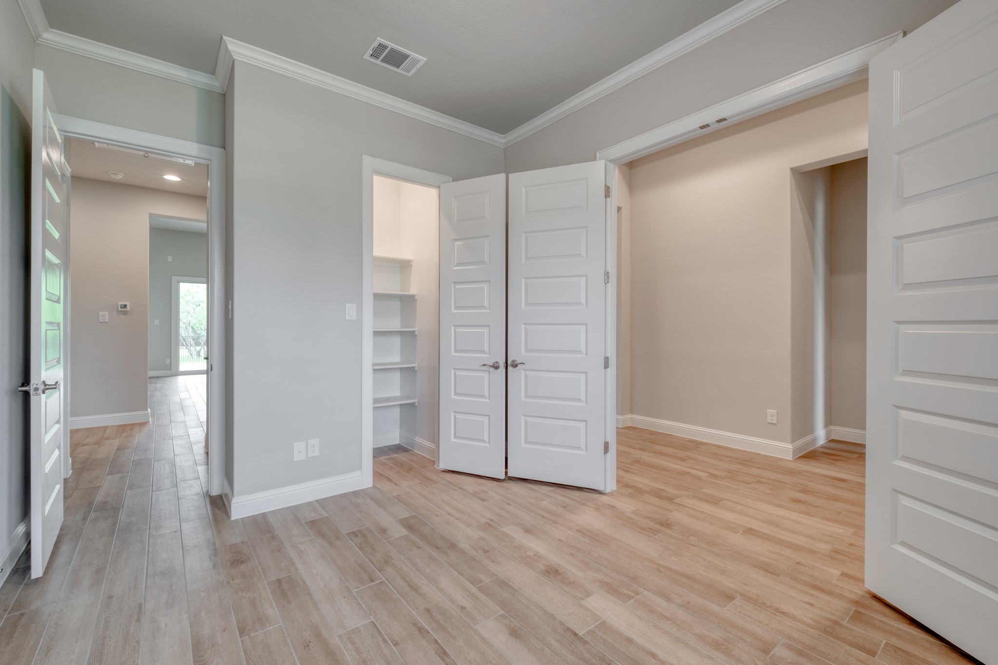 359 Raptor Beak Way Cedar Creek, TX 78612 - Photo 15 of 29 wooden floor in an empty room