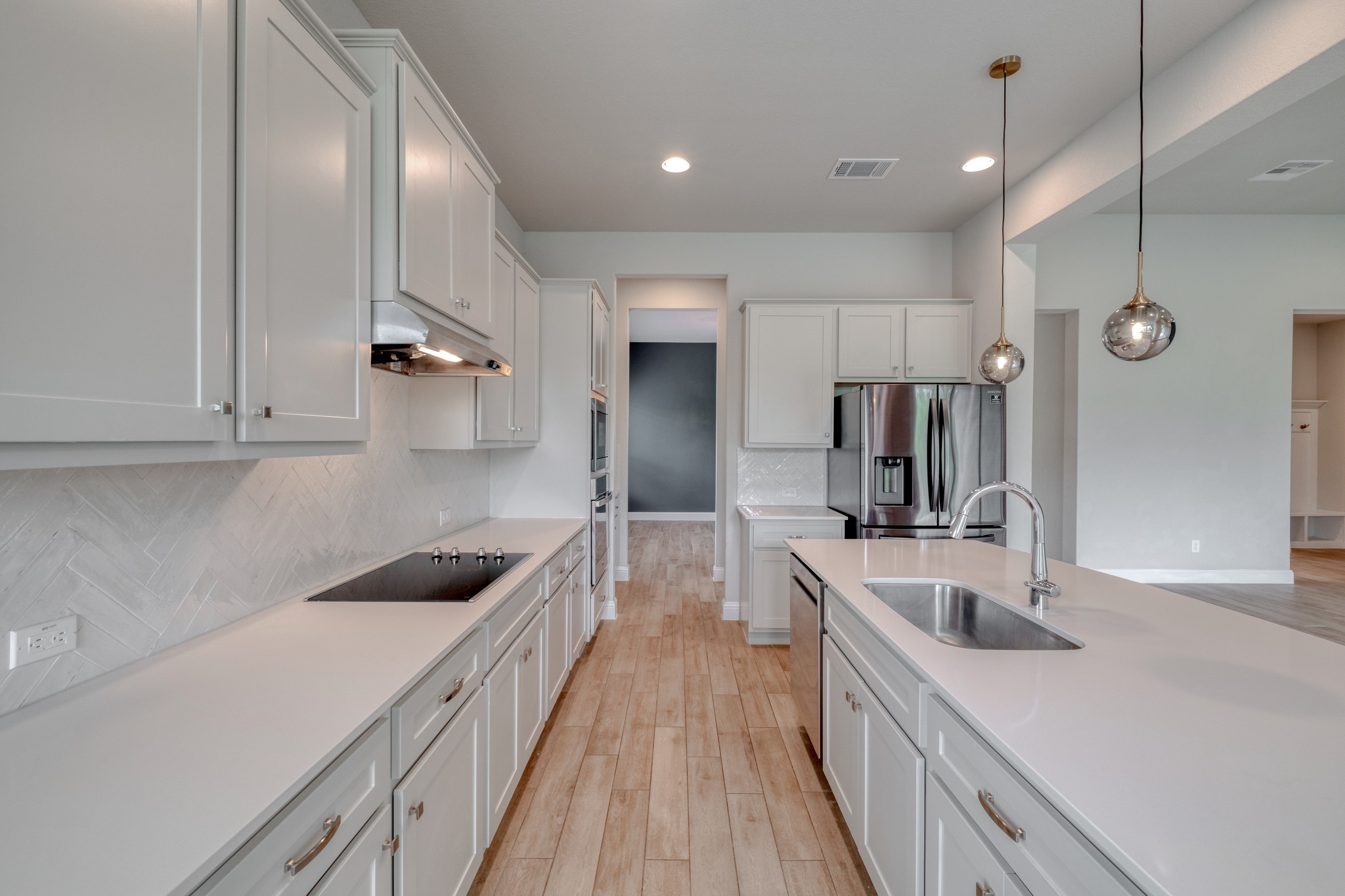 359 Raptor Beak Way Cedar Creek, TX 78612 - Photo 9 of 29 a kitchen with counter top space a sink stainless steel appliances and cabinets