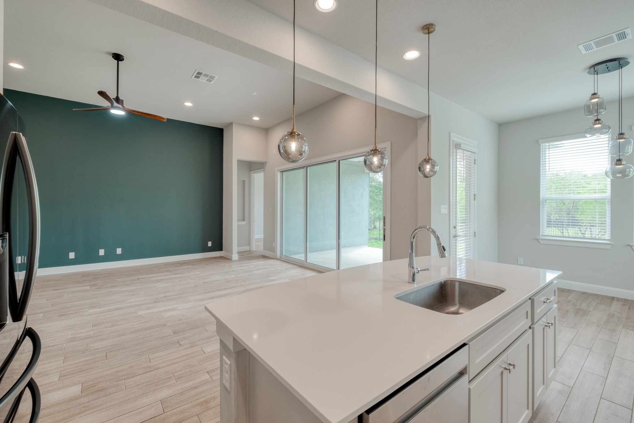 359 Raptor Beak Way Cedar Creek, TX 78612 - Photo 10 of 29 a kitchen with kitchen island a sink appliances and a counter top space