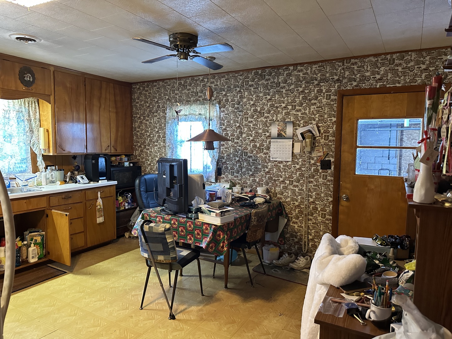 2999 Hartman Road Chadwick, IL 61014 - Photo 4 of 12 a room with furniture a window and a bookshelf