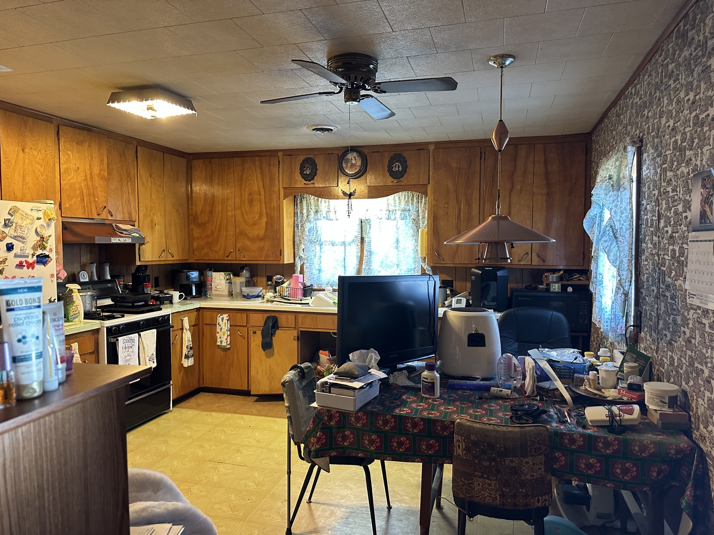2999 Hartman Road Chadwick, IL 61014 - Photo 5 of 12 a kitchen with a table chairs stove and refrigerator