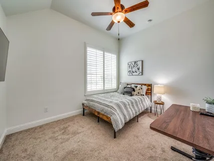 a bedroom with bed and window