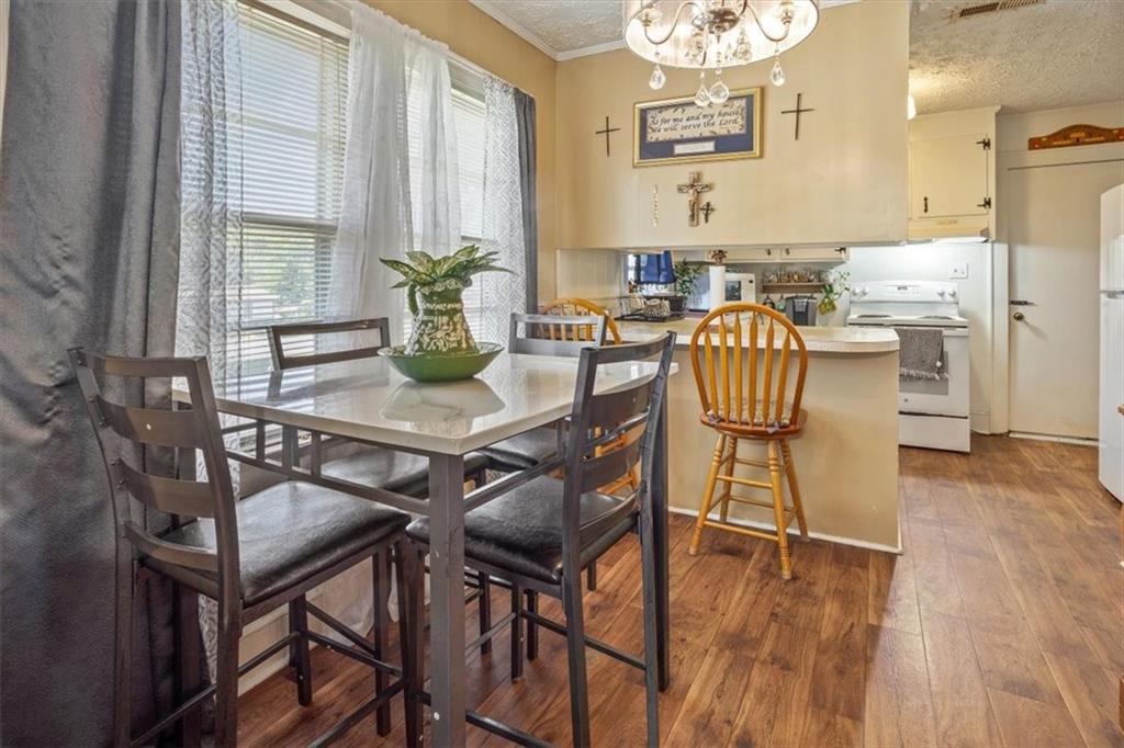 2523 Maple Road Southeast Rome, GA 30161 - Photo 11 of 30 a view of a dining room with furniture and wooden floor