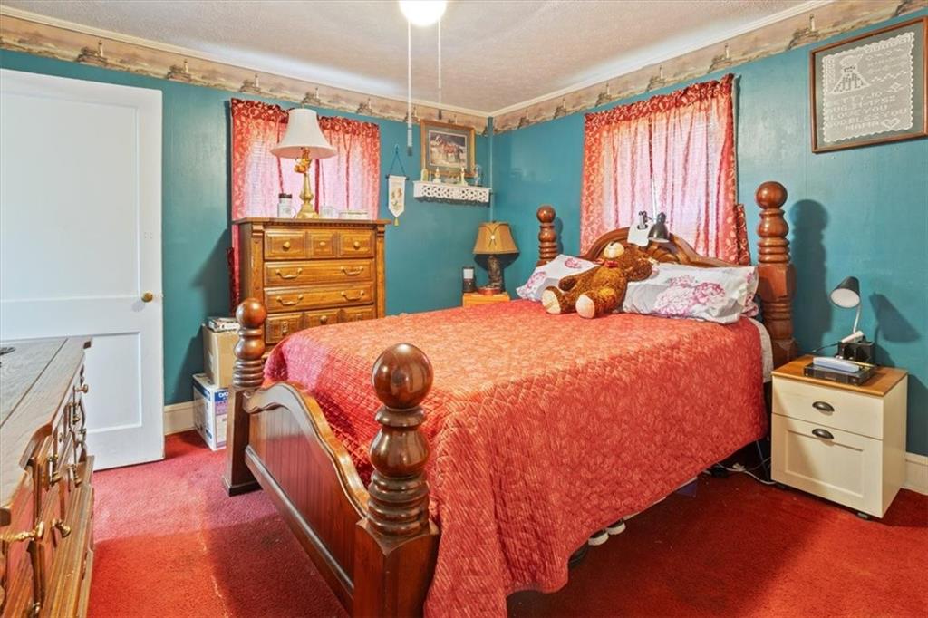 2523 Maple Road Southeast Rome, GA 30161 - Photo 20 of 30 a bed room with a bed and a window