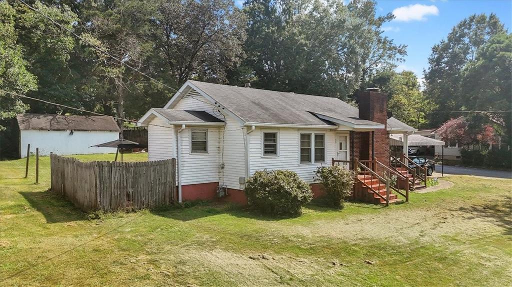 2523 Maple Road Southeast Rome, GA 30161 - Photo 2 of 30 a view of a house with backyard and sitting area